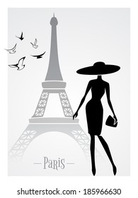 Fashionable lady in front of Eiffel Tower vector card