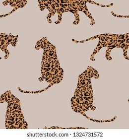 Fashionable leopard skin seamless pattern. Modern wild animal silhouette repeat illustration. Stylized spotted vector texture. Creative print on beige background. For fashion, fabric, tile, wallpaper