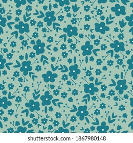 Fashionable seamless floral pattern. Endless elegant print of blue flowers . Pale green background. Printing color in a flower. Stock vector.
