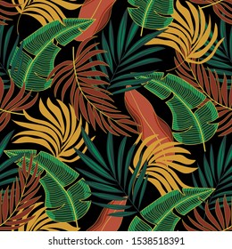 Fashionable seamless tropical pattern with beautiful brown yellow plants and leaves on black background. 
Summer colorful hawaiian seamless pattern with tropical plants. Beautiful vector floral