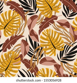Fashionable seamless tropical pattern with beautiful orange and red leaves and plants on beige background. Summer colorful hawaiian seamless pattern with tropical plants. Printing and textiles. 