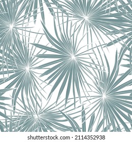 Fashionable seamless tropical pattern with blue tropical fan palm leaves on a white background. Beautiful exotic plants. Trendy summer Hawaii print. 