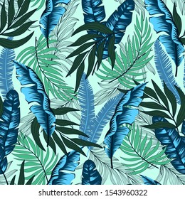 Fashionable seamless tropical pattern with bright green and blue leaves and plants on dark background. Beautiful print with hand drawn exotic plants. Exotic tropics. Summer. Printing and textiles. 