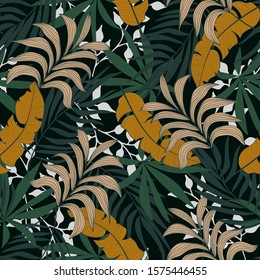 Fashionable seamless tropical pattern with bright orange and green plants and leaves on a green background. Modern abstract design for fabric, paper, interior decor. Beautiful exotic plants. 