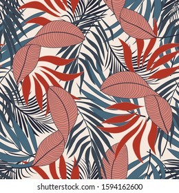 Fashionable seamless tropical pattern with bright red and blue flowers on white background. Colorful stylish floral. Beautiful print with hand drawn exotic plants.