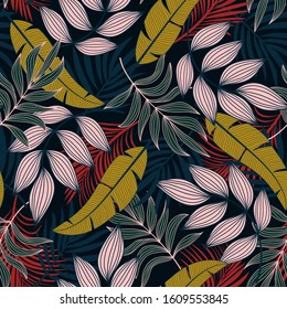 Fashionable seamless tropical pattern with bright yellow and red plants and leaves on a dark background. Summer colorful hawaiian. Beautiful seamless vector floral pattern.