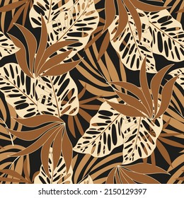 Fashionable seamless tropical pattern with bright plants and leaves on a black background. Jungle leaf seamless vector floral pattern background. Seamless exotic pattern with tropical plants.