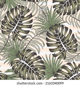 Fashionable seamless tropical pattern with bright plants and leaves on a beige background. Vector design. Jungle print. Floral background.  Trendy summer Hawaii print.