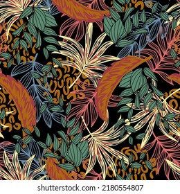 Fashionable seamless tropical pattern with bright plants and leaves on a black background. Jungle leaf seamless vector floral pattern background. Beautiful exotic plants.