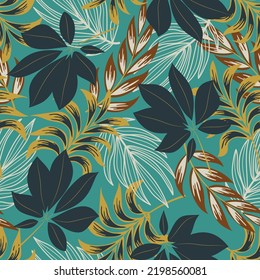 Fashionable seamless tropical pattern with bright plants and leaves on a blue background. Seamless exotic pattern with tropical plants.  Beautiful exotic plants. 