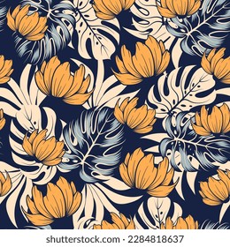 Fashionable seamless tropical pattern with bright plants and flowers on a blue background. Seamless pattern with colorful leaves and plants. Vintage pattern. Colorful stylish floral.