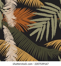 Fashionable seamless tropical pattern with green brown tropical  palms leaves on a black background. Beautiful exotic plants. Trendy summer Hawaii print. 