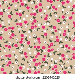 Fashionable seamless vector floral pattern. Endless print of small pink and white flowers. Light beige background. Summer and spring motifs. Stock vector illustration.