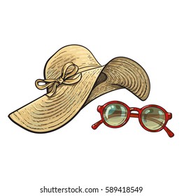 Fashionable straw hat with wide flaps and sunglasses in red round frame, summer objects, sketch vector illustration isolated on white background. Hand drawn floppy straw hat and round sunglasses