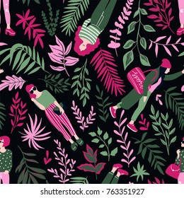 Fashionable young women in casual style with tropical leaves on the dark background. Vector hand drawn stylish seamless pattern with girls. Tropical fabric design.