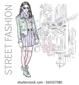 Fashionably dressed girl on the background of a city street. Vector illustration for greeting card, poster, or print on clothes. Fashion & Style. Beautiful girl.