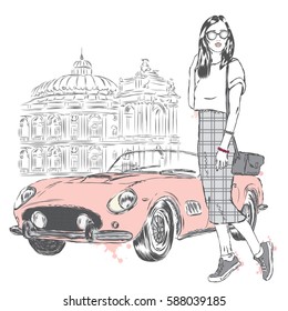 Fashionably dressed girl on the background of a city street and car. Vector illustration for greeting card, poster, or print on clothes. Fashion & Style. Beautiful girl.