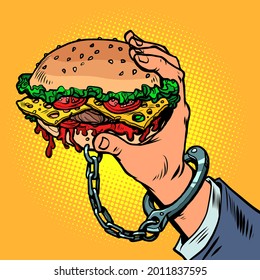 adicción a la comida rápida. La hamburguesa está esposada a la mano del hombre. Comida y restaurantes callejeros