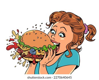 Fast food consumption. The pleasure of a fast food burger. The girl eats with joy an appetizing burger.