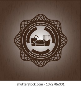 fast food icon inside badge with wood background