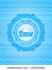 fast food icon inside light blue water wave badge.