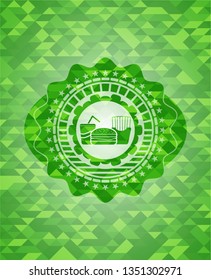 fast food icon inside realistic green mosaic emblem