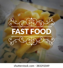 Fast food logo retro vintage typography lettering on blurred French fries background.