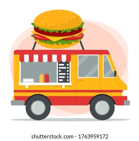 Fast food truck. Street food mobile cafe. Image of a big hamburger on the van. Colorful transport. Delicious snack in vehicle.