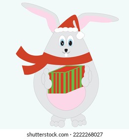 A fat New Year's rabbit in a scarf and Santa's cap