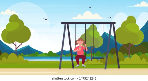 fat obese girl sitting on swing eating ice cream unhealthy nutrition obesity concept female overweight child swinging having fun outdoor summer park landscape flat full length horizontal