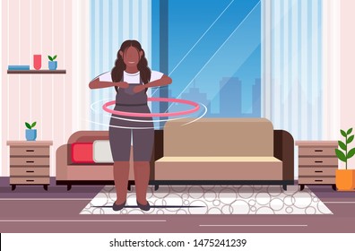 fat obese girl twisting hula hoop overweight african american woman training workout weight loss concept modern living room interior flat full length horizontal