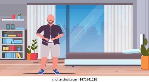 fat obese sad man buttoning shirt overweight casual guy standing pose unhealthy lifestyle obesity concept modern home apartment bedroom interior flat full length horizontal