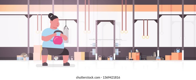 fat obese woman doing exercises with kettlebell overweight girl training in gym studio workout weight loss concept flat modern health club sudio interior horizontal