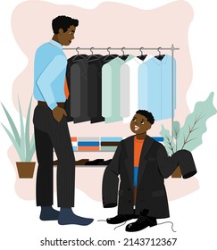 Father and his son. Little boy wears father's jacket. Dad is going to go to work. Happy family scene.