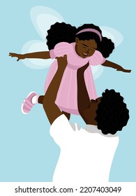 The father holds his daughter in his arms, who is dressed in a fairy costume.
