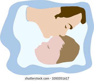 Father kissing sleeping young child