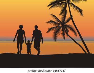 Father and mother holding son's hand on the beach