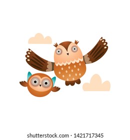 Father owl with his kid owl flying in the cloudy sky