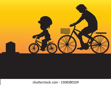 Father and son happily biking around at night.