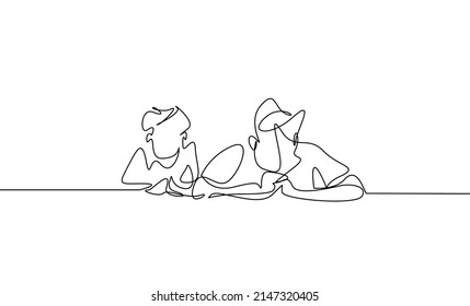 father and son lying on the floor doing something together