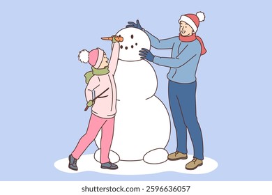 Father and son make snowman on winter street by sticking nose into head of snow sculpture. Happy dad and little boy creating snowman, rejoicing in coming of december holidays and snowfall