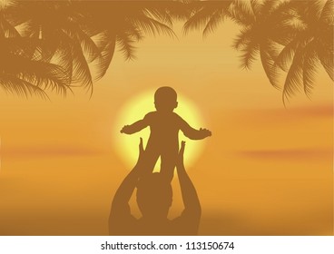 the father and the son playing on a beach at sunset