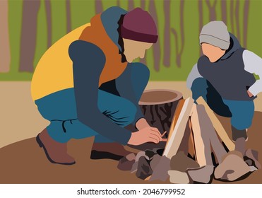 Father and son starting to make  bonfire from dry branches. Adventure camp and cooking for survival. Family in outdoor vacation