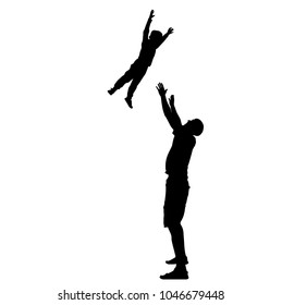 father throws his son up. Silhouettes of father and son.