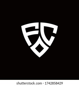 FC monogram logo with modern shield style design template isolated on black background
