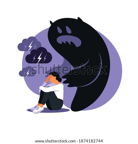 Fear or panic attack. Sad woman with lowered head frightened with his own shadow. Depressed, solitude, anxiety concept.