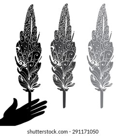 feather and hand. silhouette vector