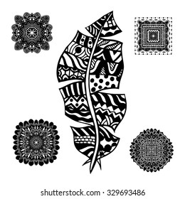 Feather and mandalas on a white background. Vintage, tribal, artistically drawn, zentangle, stylized feather. Sketch by trace. Pattern for coloring book.