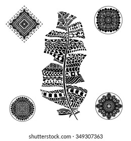 Feather and mandalas on a white background. Vintage, tribal, artistically drawn, zentangle, stylized feather. Sketch by trace. Pattern for coloring book.