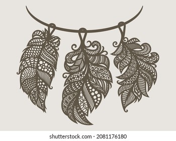 Feather necklace. Decorative pendant decoration in Indian style. Set of three openwork elements with lace ethnic ornament on string. Gray-brown objects on a light beige background. Vector illustration